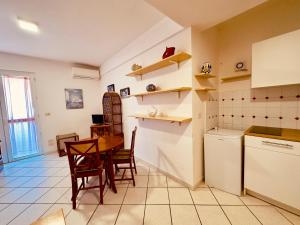 Kuchyň nebo kuchyňský kout v ubytování Hotel Baia di Talamone