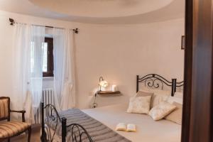 Postel nebo postele na pokoji v ubytování Masseria Montanaro