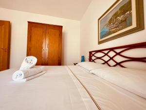Postel nebo postele na pokoji v ubytování Hotel Baia di Talamone