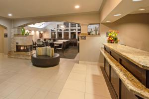 a lobby of a hotel with a restaurant at Residence Inn San Jose South in San Jose