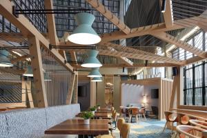 a restaurant with wooden ceilings and tables and chairs at Delta Hotels Calgary Airport In-Terminal in Calgary