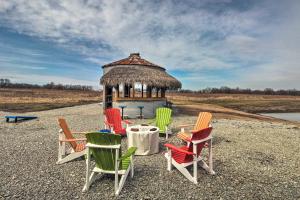 a group of colorful chairs and a gazebo at Missouri Vacation Rental with Fire Pit Access 