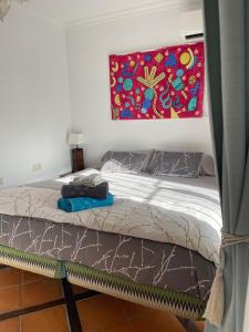 A bed or beds in a room at Terra Aloé