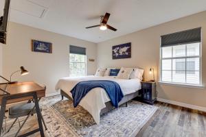 a bedroom with a bed and a desk and a window at Charming Biloxi Vacation Rental Near Beach! in Biloxi