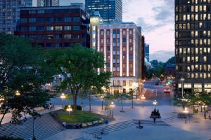 a city street with buildings and a plaza with lights at Marriott Quebec City Downtown in Quebec City