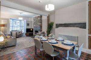 a living room with a table and chairs at Glanrhyd Townhouse in Central Dolgellau with Parking and Bike Storage in Dolgellau