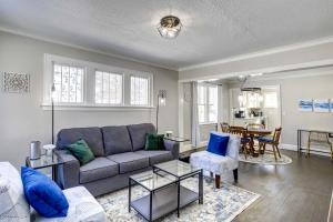 a living room with a couch and a table at Rochester Vacation Rental about 1 Mi to Downtown in Rochester