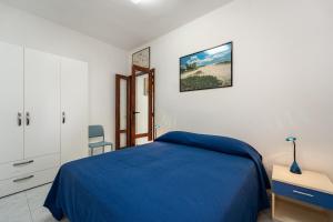 A bed or beds in a room at Monolocale Gio