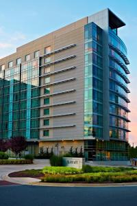 a large office building with a glass facade at Bethesda North Marriott Hotel & Conference Center in Bethesda