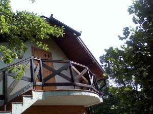 a balcony on the side of a building with trees at Apartment Carolija Zlatibor in Zlatibor