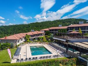 an aerial view of a resort with a swimming pool at Rocca Resort in Glavatartsi