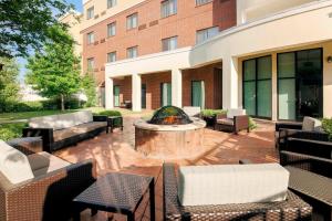 a patio with a fire pit in the middle of a building at Courtyard by Marriott Dallas Arlington South in Arlington