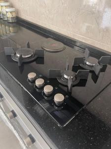 a stove top with four burners on top of it at Beautifull New 2 Bedroom Apartment in Amman in Amman