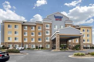a rendering of the exterior of a hotel with a parking lot at Fairfield Inn & Suites by Marriott Commerce in Commerce