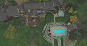 an overhead view of a large house with a swimming pool at Casia Lodge and Ranch in Twisp