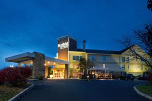 a building with a parking lot in front of it at Fairfield Inn & Suites Goshen Middletown in Goshen