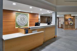 a lobby of a hospital with a reception desk at Fairfield Inn & Suites Goshen Middletown in Goshen