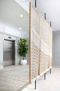 a wall of dividers in a hallway with a plant at Residence Inn by Marriott San Juan Isla Verde in San Juan