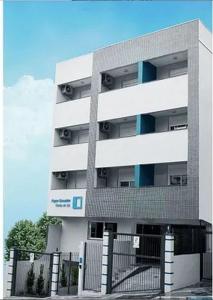 a tall building with a fence in front of it at Executive - 106 No Garage in Caxias do Sul