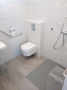 a bathroom with a toilet and a sink at Chambre indépendante vue mer et montagne in Vieux-Habitants