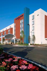 a hospital building with flowers in front of it at SpringHill Suites by Marriott Chicago Waukegan/Gurnee in Waukegan