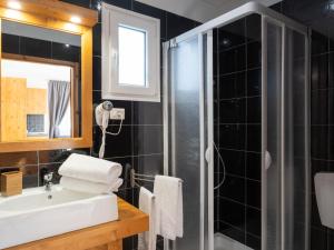 A bathroom at Holiday Home Mandorlo - SLR401 by Interhome
