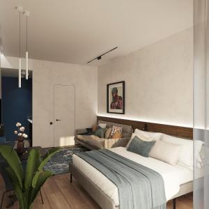 een slaapkamer met een groot bed en een bank bij Blueloft 47 l studio with balcony in Tasjkent