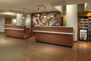 a lobby of a store with wooden counters and shelves at Fairfield Inn & Suites by Marriott Dallas Downtown in Dallas