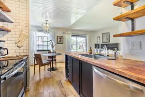 a kitchen with a sink and a counter top at Austin Condo with Patio - 4 Mi to Downtown! in Austin