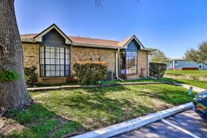 a brick house with a tree in front of it at Austin Condo with Patio - 4 Mi to Downtown! in Austin