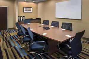 a conference room with a large wooden table and chairs at Fairfield Inn & Suites by Marriott New Castle in New Castle