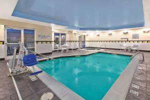 a pool with blue water in a hotel room at Fairfield Inn & Suites by Marriott Lexington North in Lexington