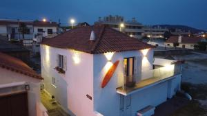 a white building with lights on top of it at Casa de Chanquete in Viana do Castelo +16 photos