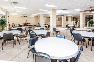 a classroom with tables and chairs in a room at Islander W 304 in Fort Walton Beach