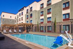 a swimming pool in front of a building at TownePlace Suites by Marriott San Luis Obispo in San Luis Obispo
