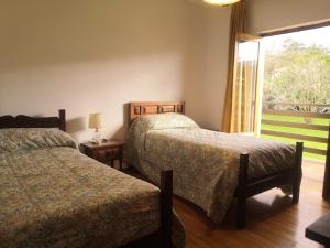 Un pat sau paturi într-o cameră la Chalet Las Llamas