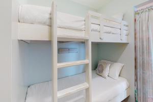 a bunk bed room with two bunk beds in a bedroom at Perdido Skye G3 in Perdido Key +12 photos