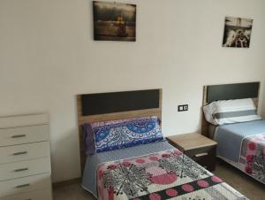 Ένα ή περισσότερα κρεβάτια σε δωμάτιο στο Apartamento Primera Línea de Mar en EbreHogar +15 φωτογραφίες