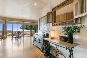 a kitchen with a counter and a table in a room at Shirri Mirri in Leura