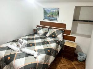 Letto o letti in una camera di Hospedaje Rumiñahui
