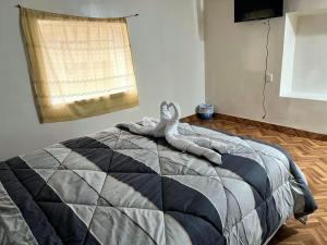 Letto o letti in una camera di Hospedaje Rumiñahui