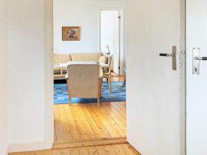 an open door to a living room with a table at 6 person holiday home in HENÅN-By Traum in Henån