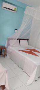Letto o letti in una camera di Sigiri Lion Lodge