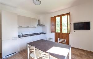 A kitchen or kitchenette at Lovely Apartment In Longobardi Marina