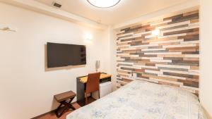 Postel nebo postele na pokoji v ubytování Yokohama Town Hotel + 30 fotografií