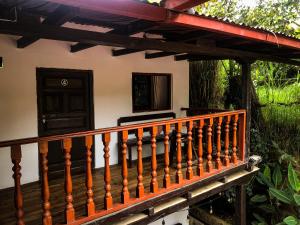 a wooden railing on a porch of a house at Killa Wasi B&B in Chachapoyas