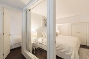 Cama ou camas em um quarto em Parc Avenue Residences Mile End
