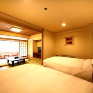 Cama o camas de una habitación en Hotel Okuyumoto