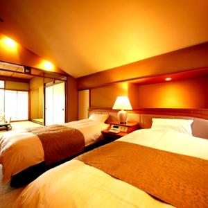 Letto o letti in una camera di Hotel Okuyumoto