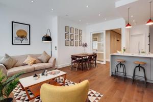 a living room with a couch and a table at Number 10 Borough Apartments 2 Bed 2 Bath in London